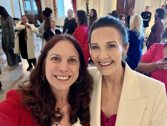 On March 18, 2024, Dr. Shogan (ran into Lynda Carter , actress known for playing Wonder Woman, while attending a Women's History Month celebration at the White House. National Archives photo by Dr. Colleen Shogan