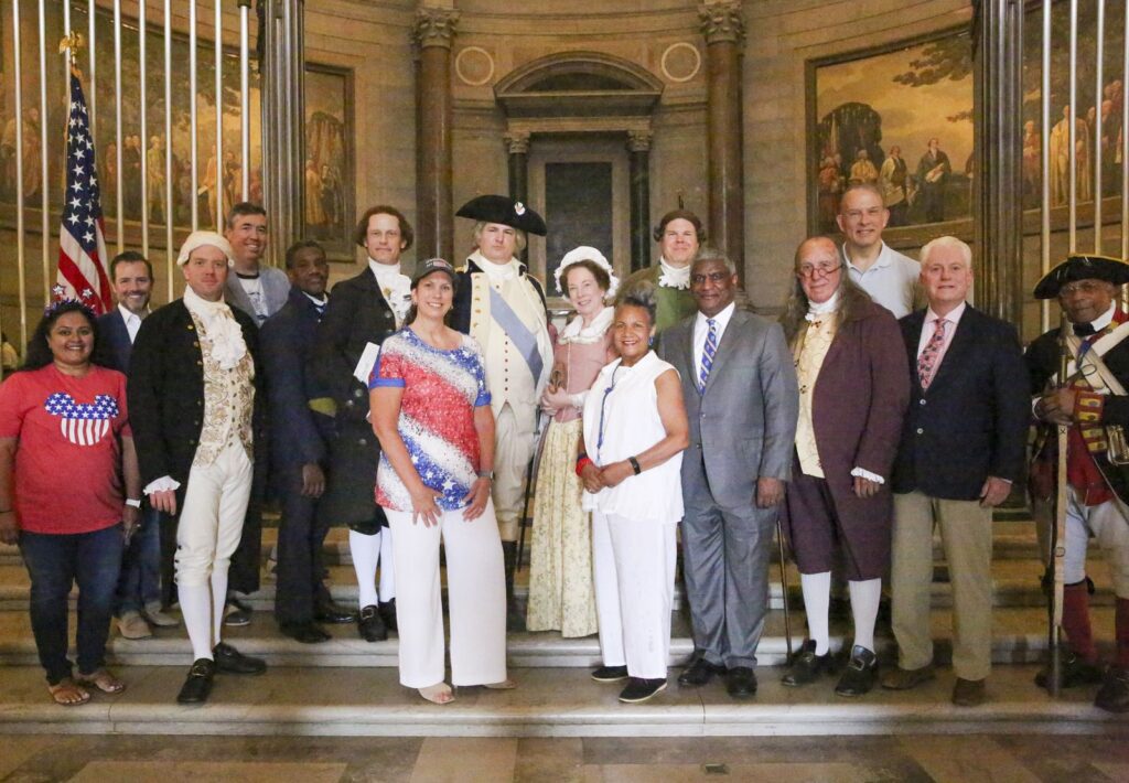 Here Dr. Shogan poses with the reenactors who read the Declaration of Independence in the Rotunda.