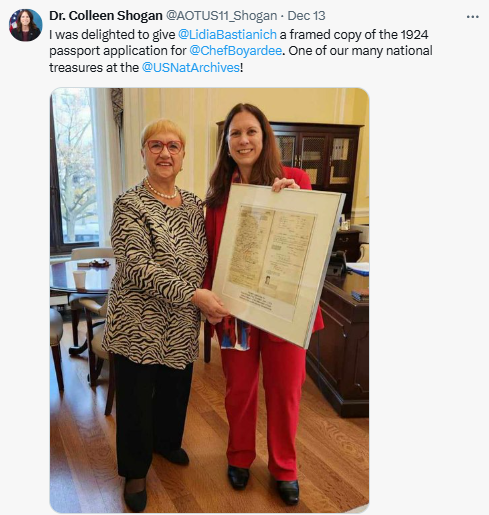 Archivist of the United States Dr. Colleen Shogan and Lidia Bastianich with a framed copy of Chef Boyardee's 1924 passport application. December 13, 2024. National Archives photo by Jenna Edwards.